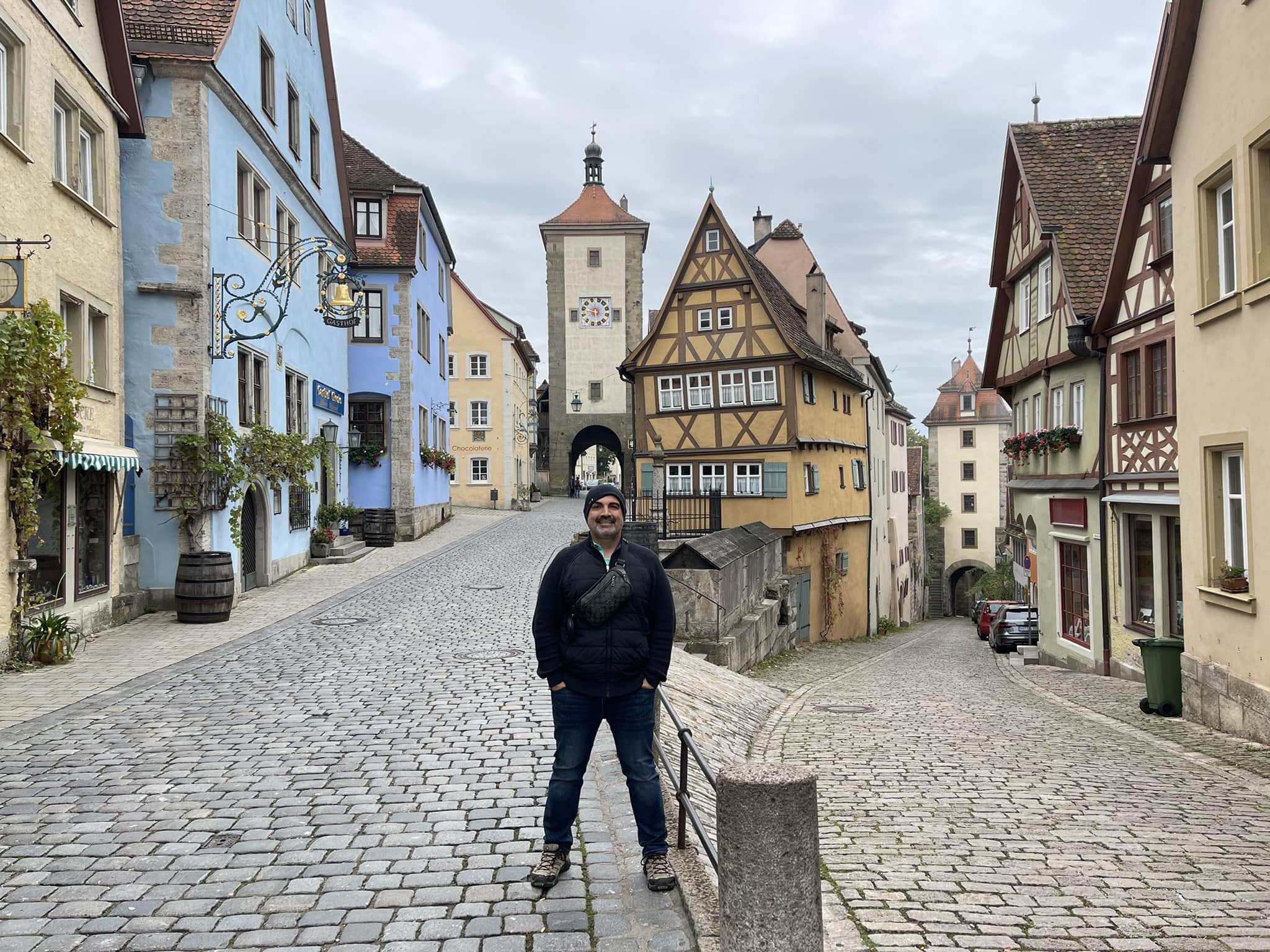 Me standing in front of the The Plönlein, a famous landmark in Rothenburg ob der Tauber