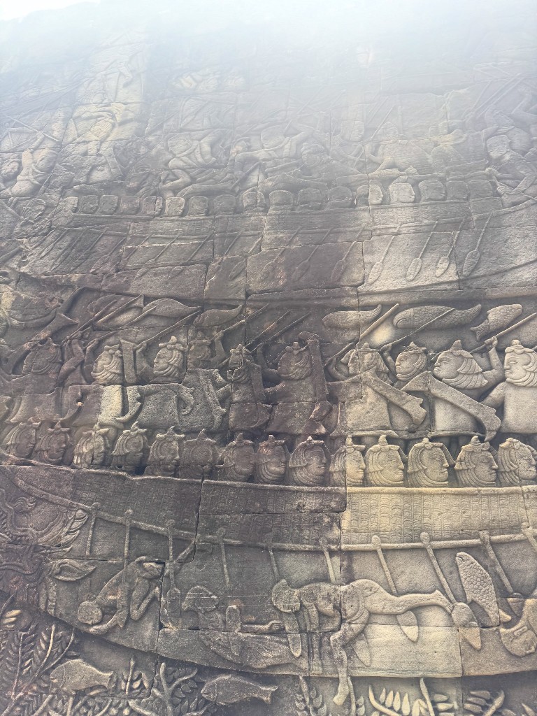 A gallery panel showing a naval battle, rows of warriors packed into boats